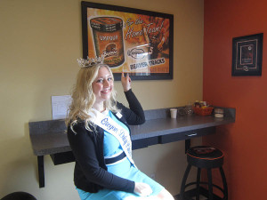 Oregon Dairy Princess Emma Miller with Beaver Tracks sign